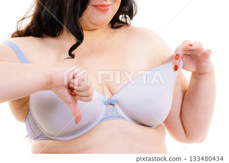 Woman big breast thumb down sign Woman big breast thumb down sign 133480434
