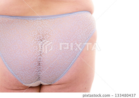 Plus size woman in lingerie back view. Plus size woman in lingerie back view. 133480437