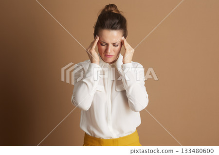 Woman in Yellow Skirt with Stress Headache 133480600