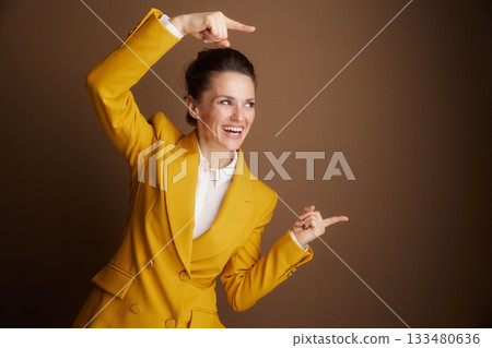 Enthusiastic Businesswoman Presenting an Idea 133480636