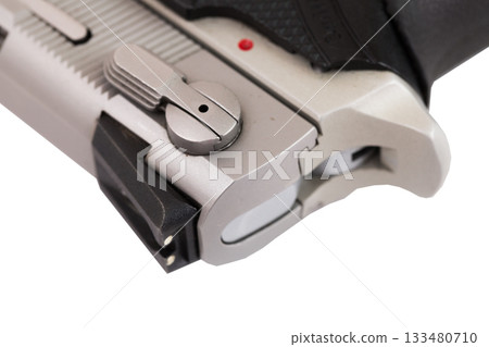 Close-up of handgun safety and rear sight 133480710