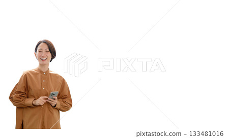 A woman operating a mobile phone (center) A woman operating a mobile phone (center) 133481016