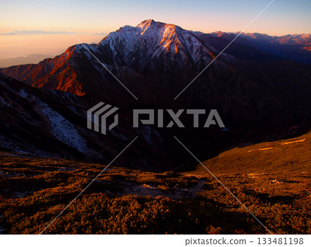 Mount Goryu shining in the morning glow (viewed from Mount Karamatsu) 133481198