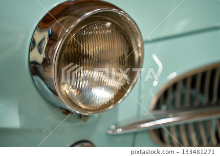 Retro car front details with headlight grill and chrome bumper Retro car front details with headlight grill and chrome bumper 133481271