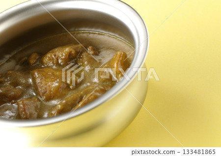 Chicken curry served on silver tableware 133481865