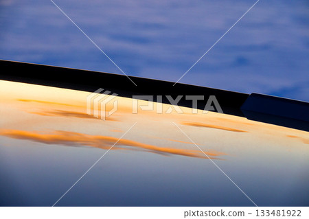 A sentimental scene of the winter Hokkaido evening sky reflected on the roof of a car A sentimental scene of the winter Hokkaido evening sky reflected on the roof of a car 133481922
