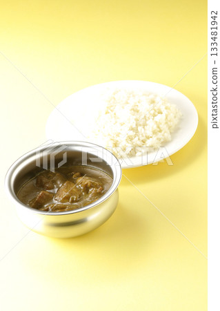 Chicken curry and rice served on silver tableware Chicken curry and rice served on silver tableware 133481942