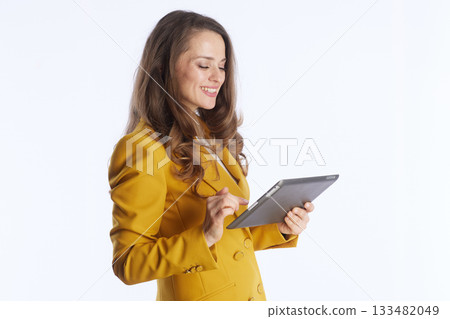 Executive Woman Using Tablet for Business Tasks Executive Woman Using Tablet for Business Tasks 133482049