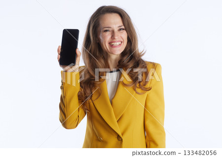 Smiling Businesswoman Presenting a Smartphone Smiling Businesswoman Presenting a Smartphone 133482056