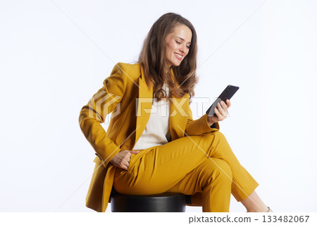 Focused Businesswoman Engaged with Smartphone Focused Businesswoman Engaged with Smartphone 133482067