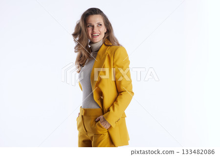 Smiling Businesswoman in Yellow Suit - Studio Portrait Smiling Businesswoman in Yellow Suit - Studio Portrait 133482086