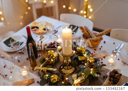 A table set for dinner meal at Christmas time. 133482167