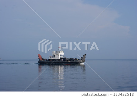 In the foreground is a platform-ferry for transporting cars and people to Olkhon Island. 133482518