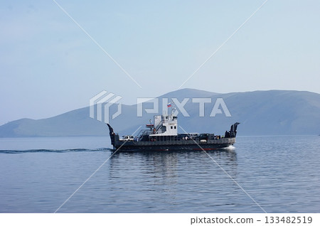 In the foreground is a platform-ferry for transporting cars and people to Olkhon Island. 133482519