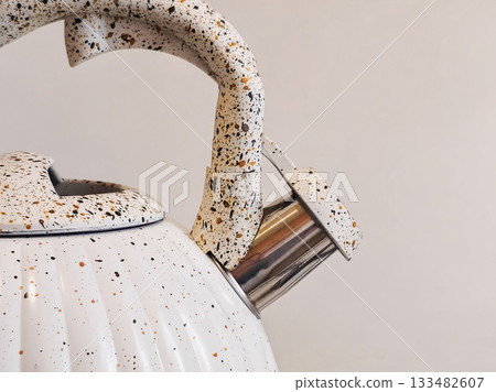 Close up the whistle on the kettle. 133482607