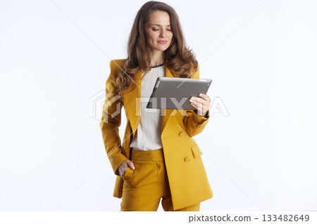 Focused Professional Working on Digital Tablet 133482649