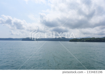 Kunisaki Peninsula as seen from the ferry heading to Himeshima Kunisaki Peninsula as seen from the ferry heading to Himeshima 133483196