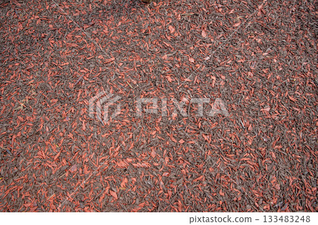 rubber coating of run track, playground or sports ground texture background. Rubber mulch imitating wood chips, shavings, fractions 12-50 mm. red brown Rubber Playground Surfacing, sports grounds. rubber coating of run track, playground or sports ground texture background. Rubber mulch imitating wood chips, shavings, fractions 12-50 mm. red brown Rubber Playground Surfacing, sports grounds. 133483248