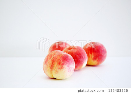 Freshly picked peaches 133483326