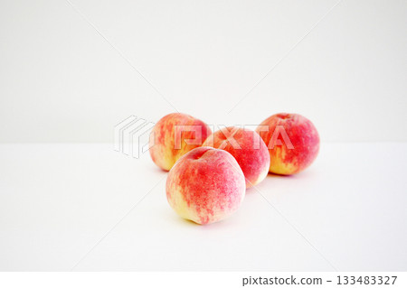 Freshly picked peaches 133483327