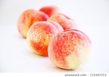 Freshly picked peaches 133483353
