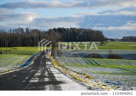 Winter Road Through Rolling Fields in Latvia Winter Road Through Rolling Fields in Latvia 133484001