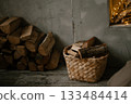 Cozy Firewood Basket and Stack in Rustic Interior 133484414