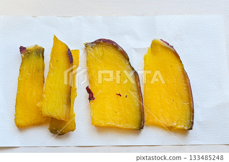 Sticky dried sweet potato 133485248