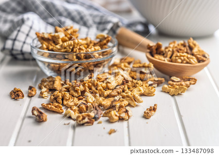 Peeled walnut kernels on white table. 133487098