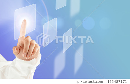 Hand touching virtual interface button on a futuristic digital screen 133487171