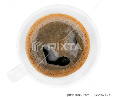 Hot aromatic black coffee in a white cup, top view on white background 133487173