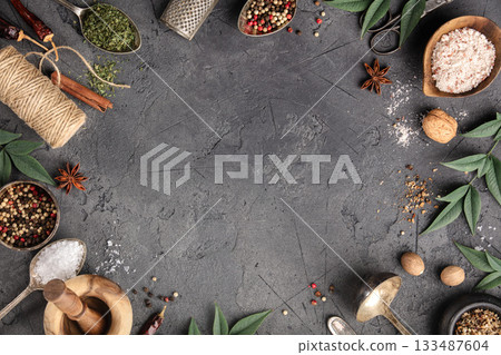 Rustic Culinary Flat-Lay with Vintage Silverware, Spices, Herbs, and Natural Elements on Stone Background Rustic Culinary Flat-Lay with Vintage Silverware, Spices, Herbs, and Natural Elements on Stone Background 133487604