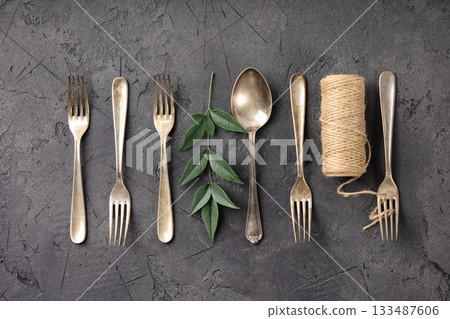 Rustic Culinary Flat-Lay Collection with Vintage Silverware, Herbs, Spices, Greenery, and Natural Materials 133487606