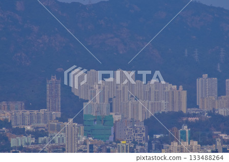 The view of Hong Kong cityscape from the Peak of Hong Kong. Beautiful and stunning view of Hong Kong. Hong Kong Cityscape and skyline. The view of Hong Kong cityscape from the Peak of Hong Kong. Beautiful and stunning view of Hong Kong. Hong Kong Cityscape and skyline. 133488264