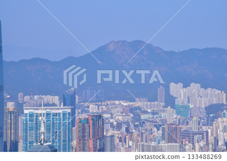 The view of Hong Kong cityscape from the Peak of Hong Kong. Beautiful and stunning view of Hong Kong. Hong Kong Cityscape and skyline. The view of Hong Kong cityscape from the Peak of Hong Kong. Beautiful and stunning view of Hong Kong. Hong Kong Cityscape and skyline. 133488269