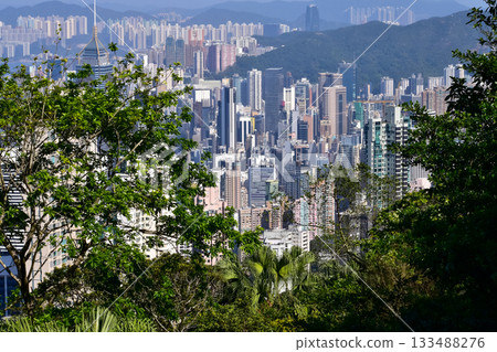 The view of Hong Kong cityscape from the Peak of Hong Kong. Beautiful and stunning view of Hong Kong. Hong Kong Cityscape and skyline. The view of Hong Kong cityscape from the Peak of Hong Kong. Beautiful and stunning view of Hong Kong. Hong Kong Cityscape and skyline. 133488276