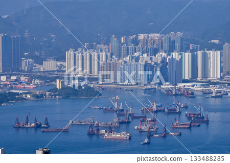 The view of Hong Kong cityscape from the Peak of Hong Kong. Beautiful and stunning view of Hong Kong. Hong Kong Cityscape and skyline. The view of Hong Kong cityscape from the Peak of Hong Kong. Beautiful and stunning view of Hong Kong. Hong Kong Cityscape and skyline. 133488285