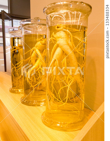 Ginseng in a bottle. Ginseng from Korea mixed with soju water in a bottle. 133488334
