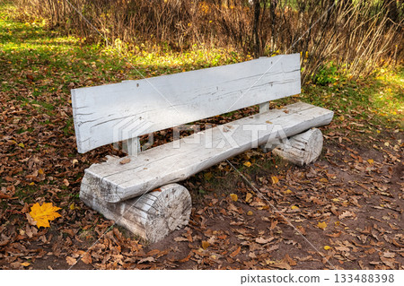 White bench made of logs. 133488398