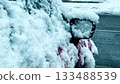 Snow covered car mirror and door during early winter weather 133488539