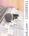 dynamic microphone on audio mixing console. singing, recording concept 133489551