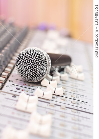 dynamic microphone on audio mixing console. singing, recording concept 133489551
