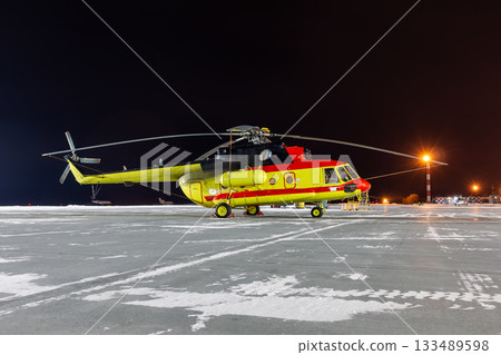 Medical helicopter on winter airport at night Medical helicopter on winter airport at night 133489598