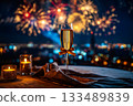 A new year card with a glass of champagne and fireworks in night sky. 133489839