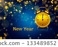 The golden alarm clock set 0 o'clock in New year card with golden bokeh on blue background. 133489852
