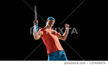 Joyful tennis player celebrating victory with bright emotion and confidence Joyful tennis player celebrating victory with bright emotion and confidence 133489976