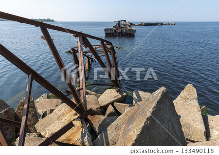 Broken bridge and pier of Battery bay in Russia. Abandoned submarine base 133490118