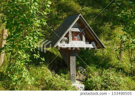 Traditional Wooden Wayside Shrine in Austrian Alps Traditional Wooden Wayside Shrine in Austrian Alps 133490505