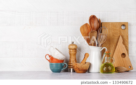 Kitchen utensils and spices on table 133490672
