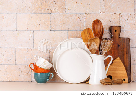 Kitchen utensils and cutting boards on table Kitchen utensils and cutting boards on table 133490675